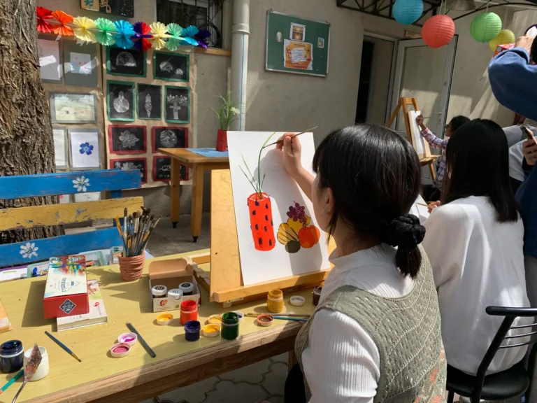 Student paining outdors