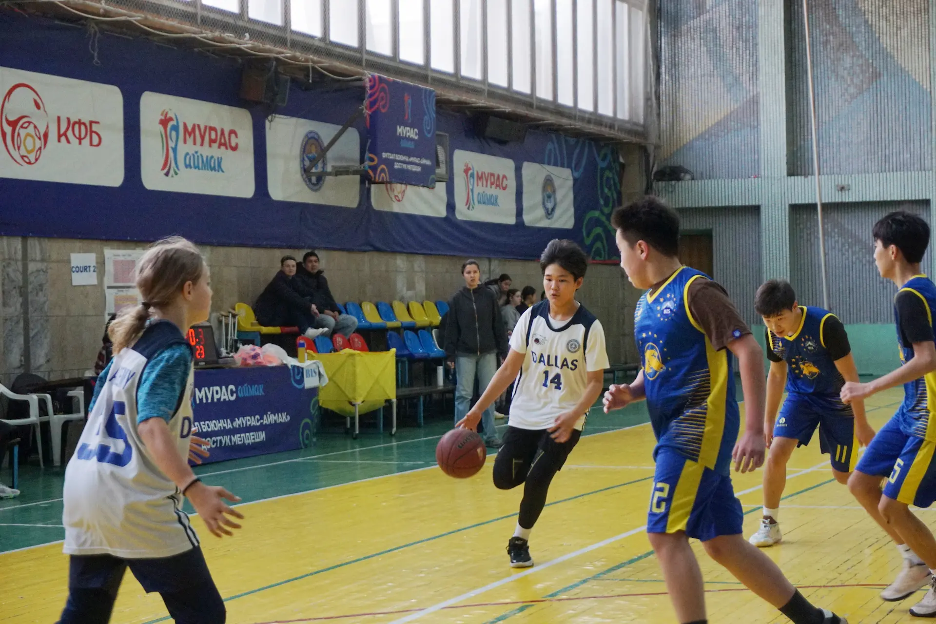 Student playing basketball