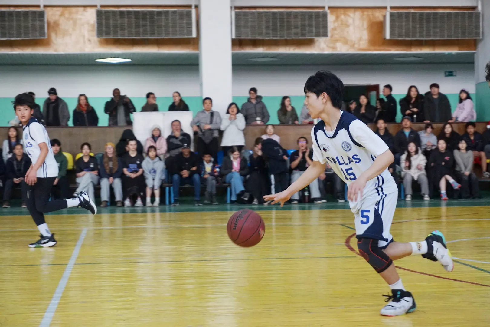 Student playing basketball