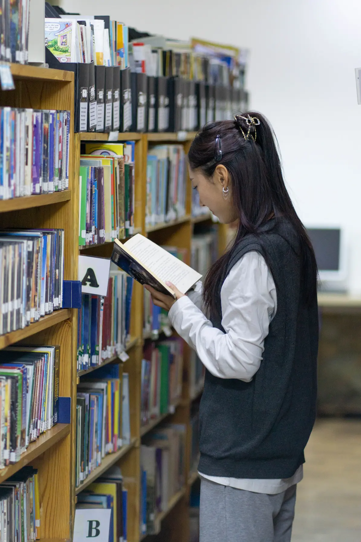 Student reading in the library