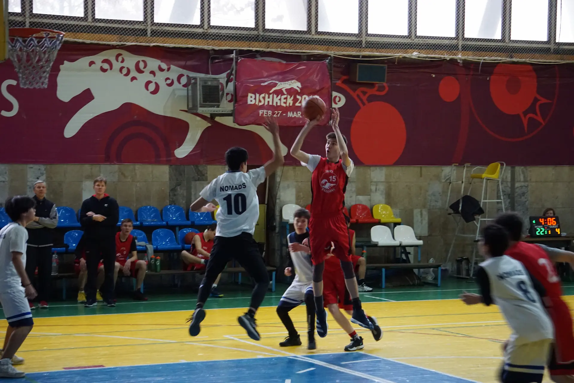 Student throwing the ball into the basket