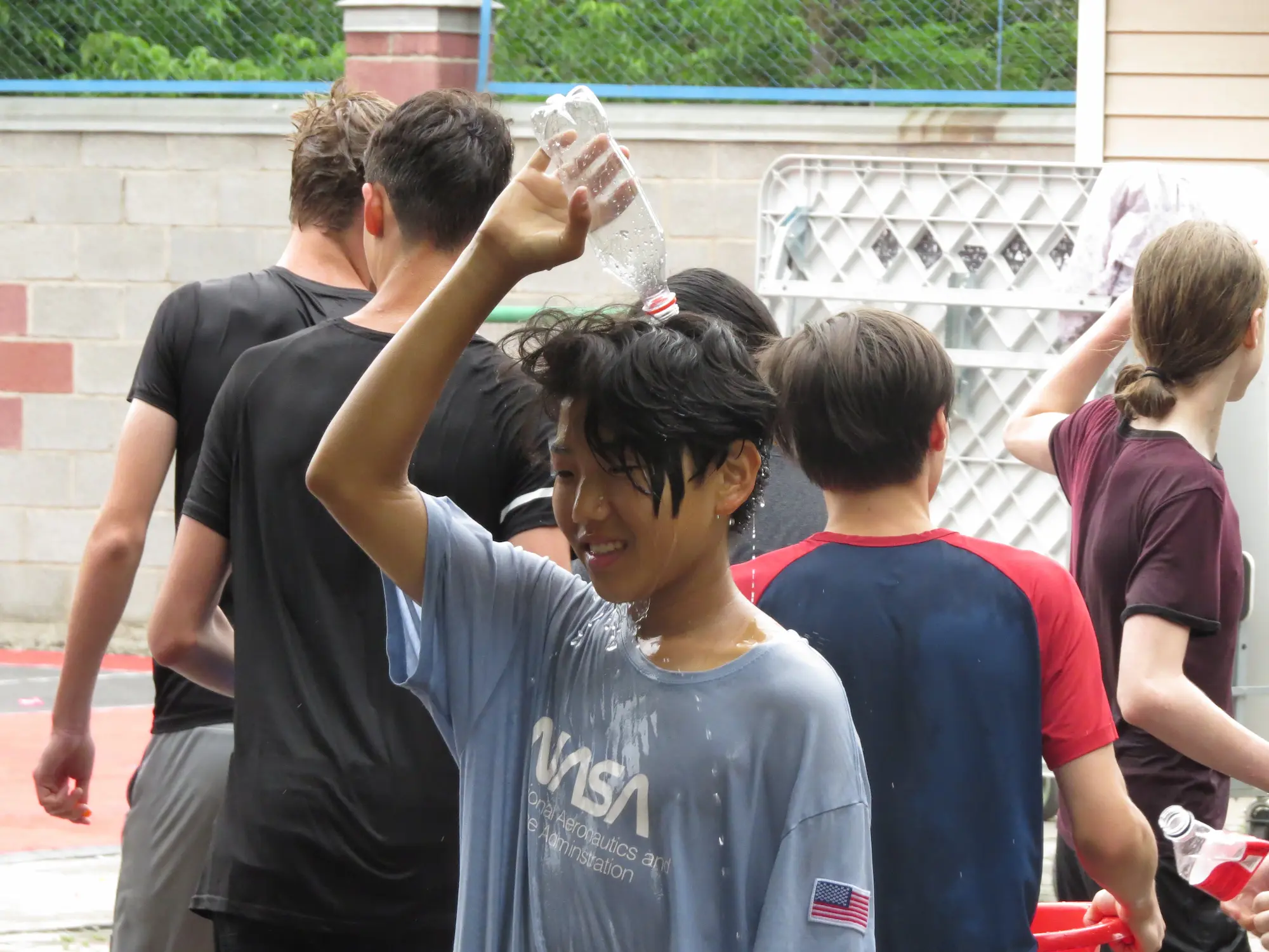 Water fight on the outdoor basketball court